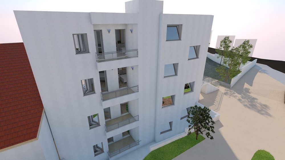 Visualisation du bâtiment vu de côté avec des arbres devant