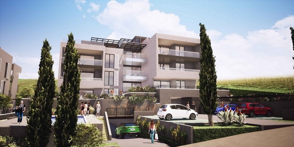 Visualisation de l'immeuble d'appartements neuf avec places de stationnement