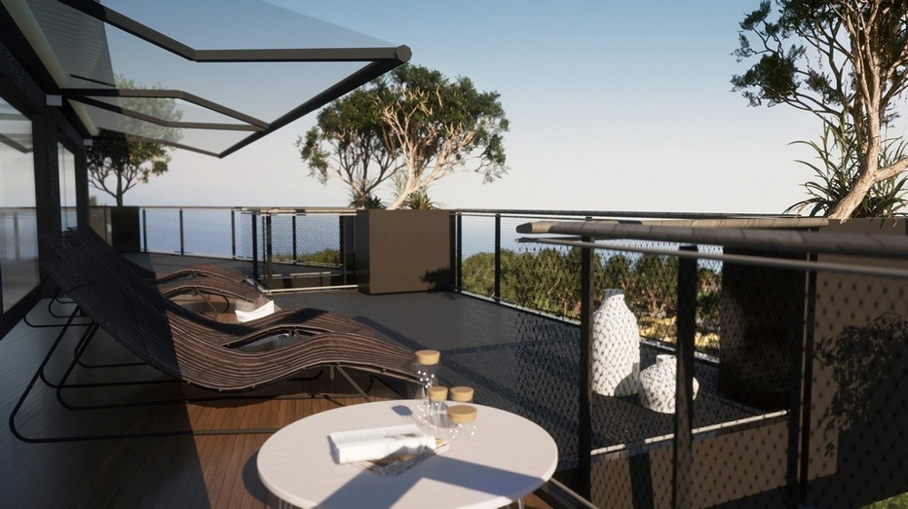 Visualisation de la terrasse avec bains de soleil et table face à la mer