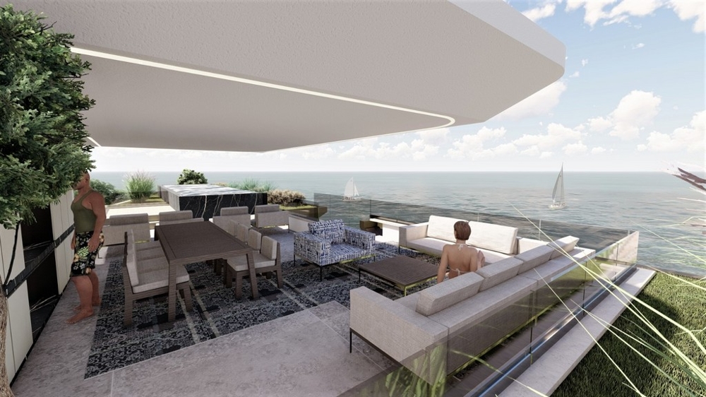 Visualisation de la terrasse avec table à manger et vue sur la mer