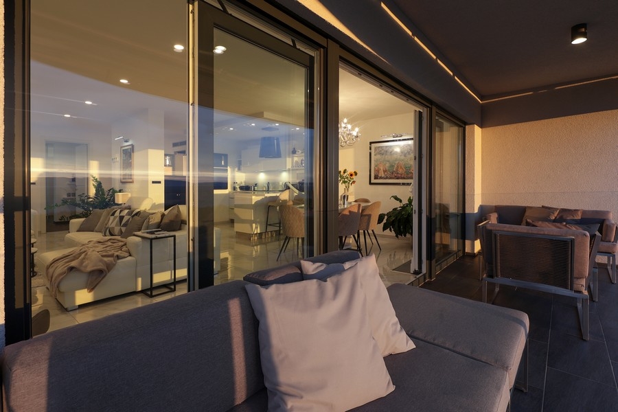 Terrasse éclairée avec mobilier de salon le soir