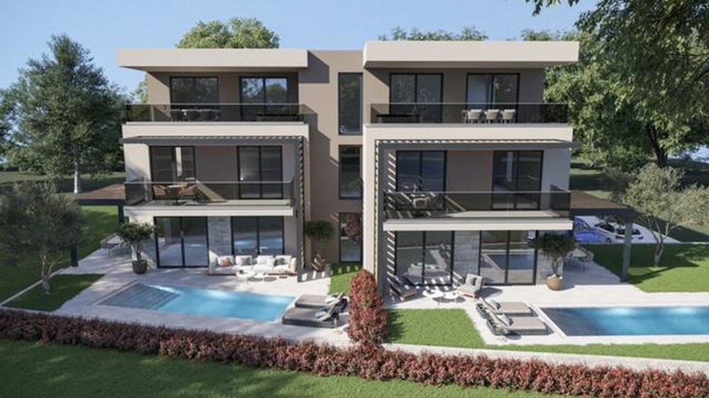 Visualisation de deux maisons avec piscines dans la pelouse