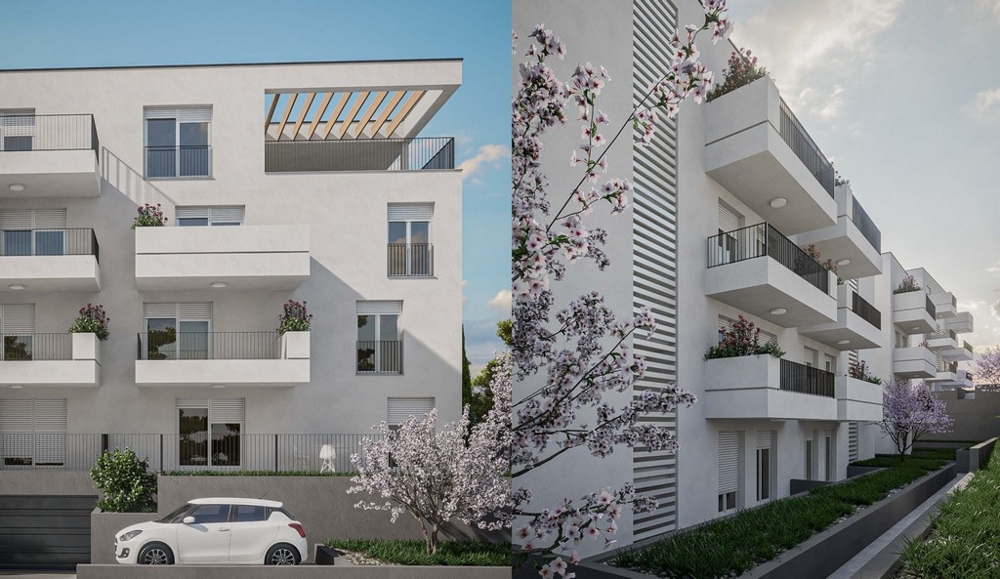 Vue depuis la rue des appartements neufs à Okrug Gornji, île de Ciovo, Croatie, avec balcons et arbres en fleurs.
