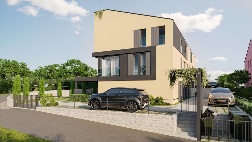 Façade jaune de la maison avec éléments sombres et deux voitures garées