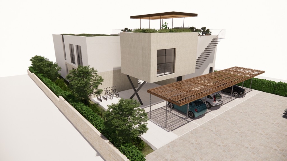 Arrière du bâtiment avec places de parking couvertes.