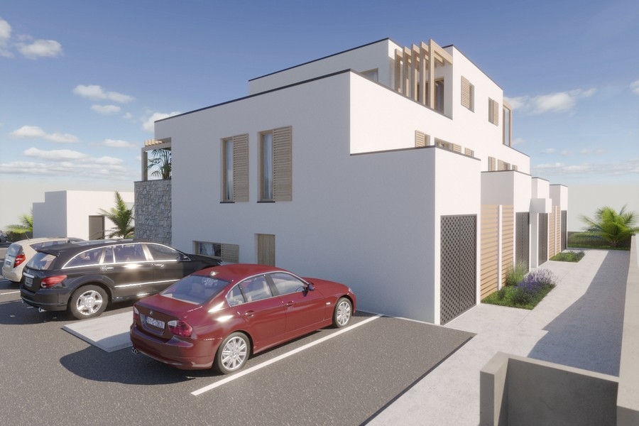 Places de stationnement devant l'immeuble neuf moderne A3615 à Privlaka en Croatie.