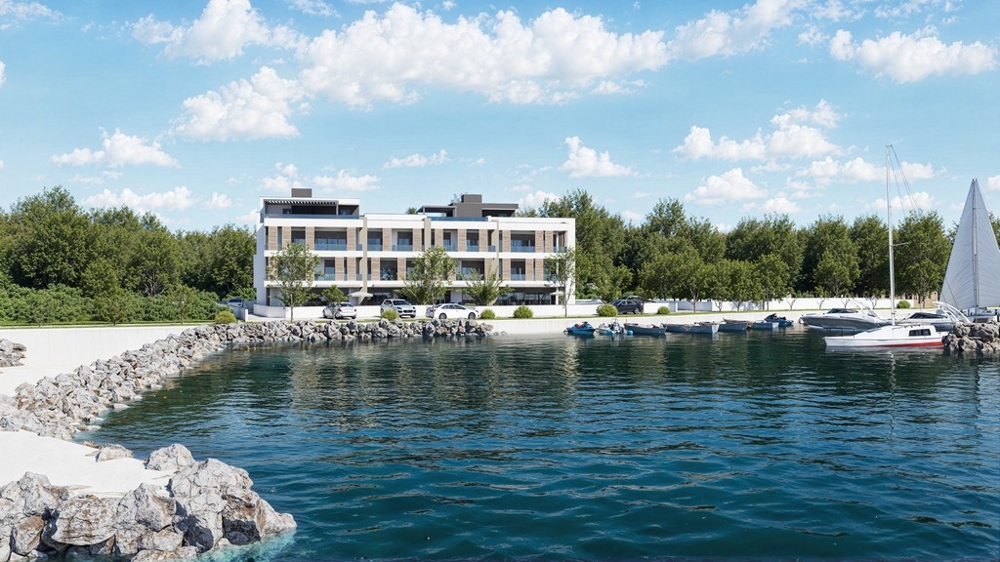 Visualisation de la résidence directement sur la côte avec ponton d'amarrage