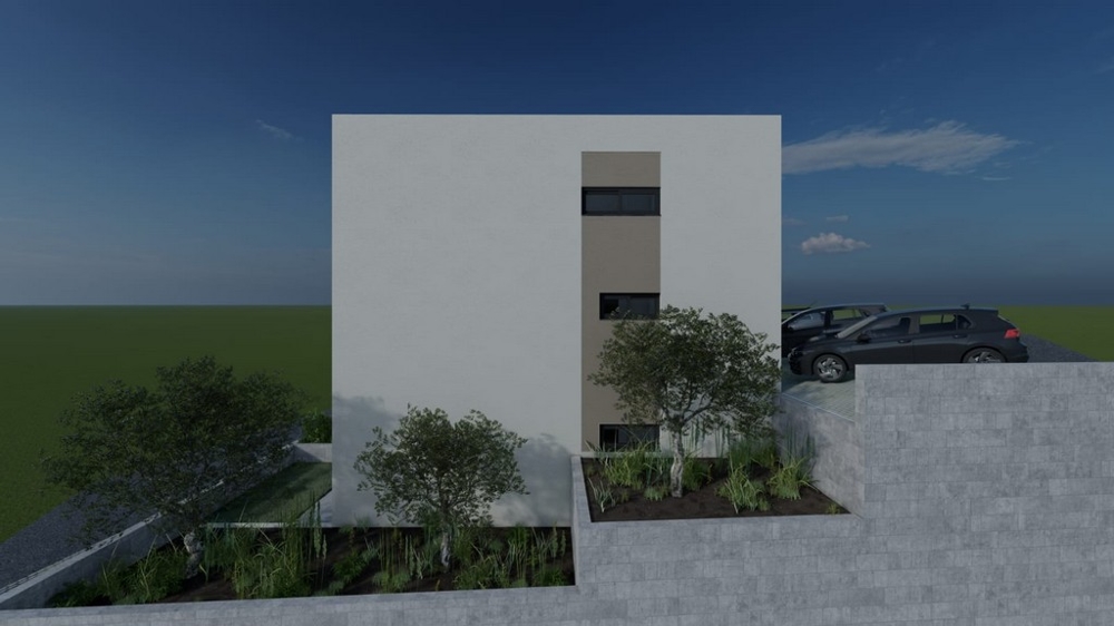 Vue latérale de l'immeuble d'habitation avec places de stationnement