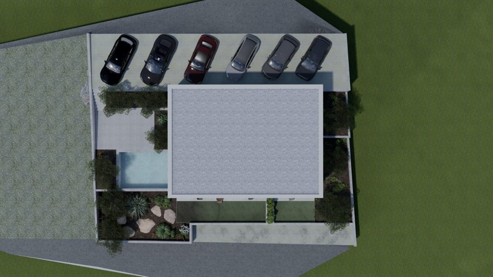 Vue de dessus de l'immeuble d'habitation avec places de stationnement et piscine