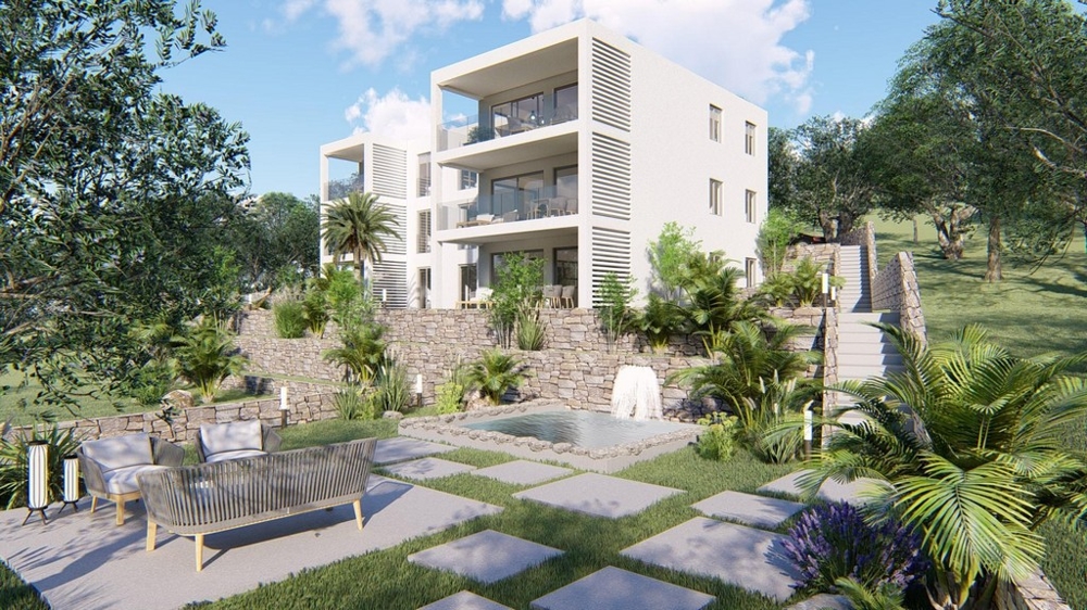 Jardin avec coin lounge et vue sur la résidence neuve en Croatie