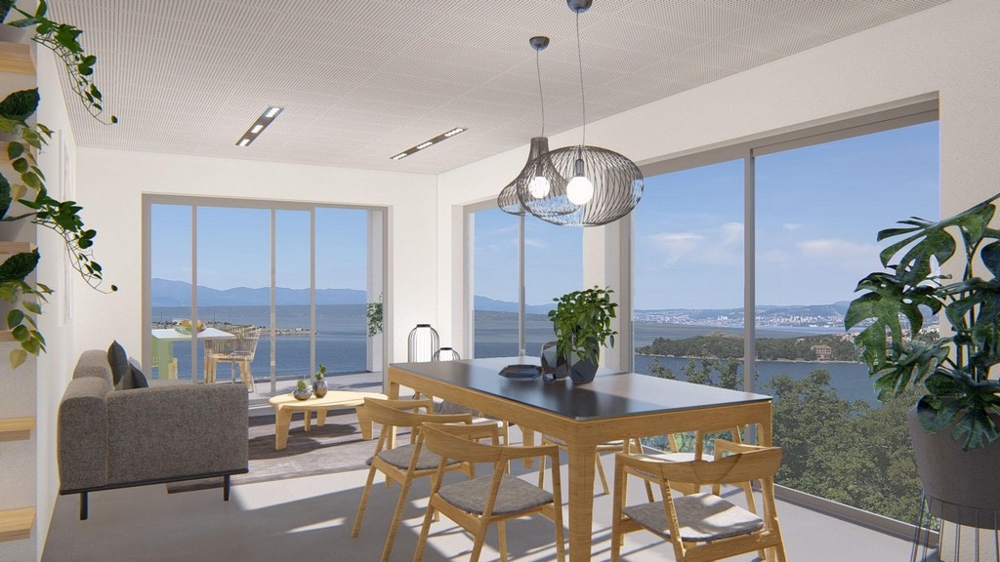 Séjour lumineux avec coin repas et vue mer panoramique