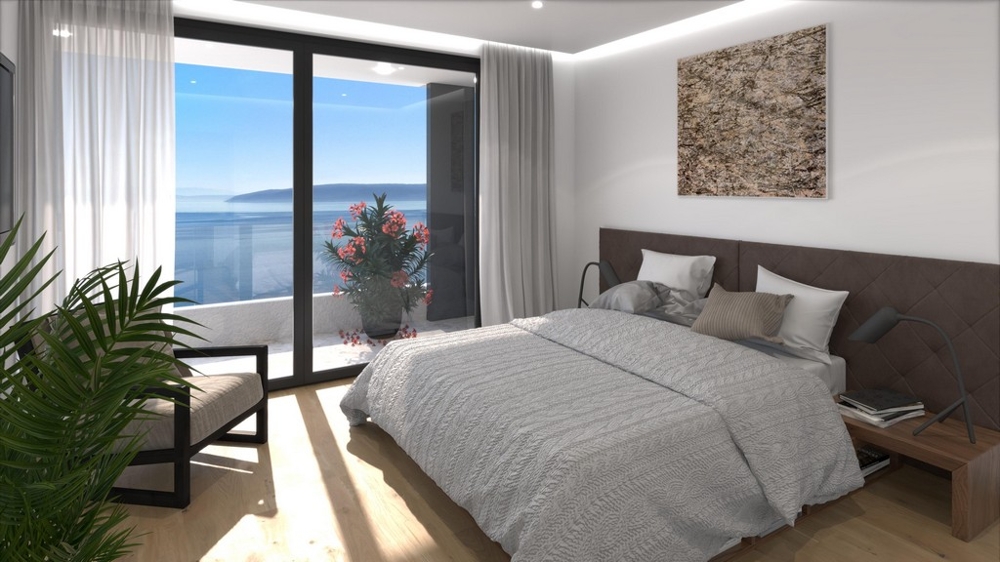 Chambre avec grande fenêtre et vue mer