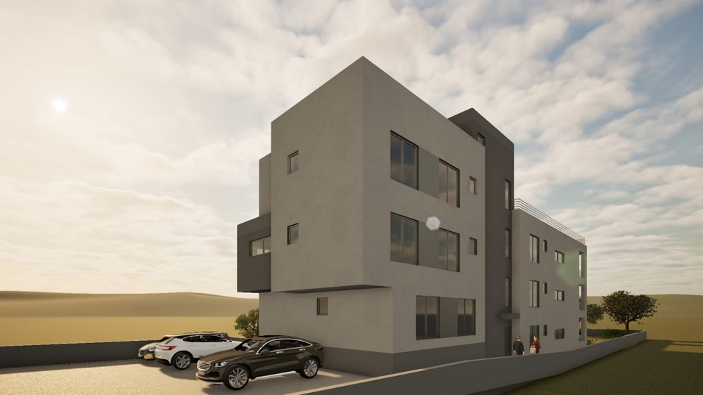 Immeuble d'habitation neuf avec places de stationnement devant le bâtiment