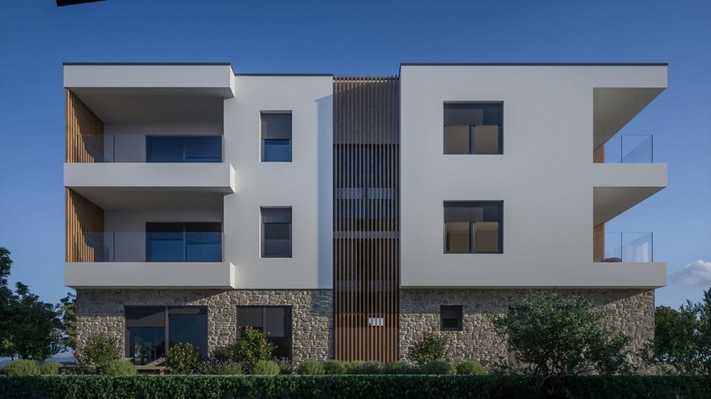 Immeuble collectif moderne avec balcons et façade en pierre naturelle