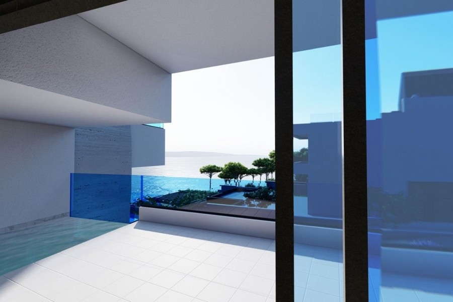 Terrasse avec garde-corps en verre et vue sur la mer