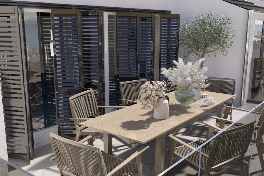 Terrasse avec coin salon et vue mer