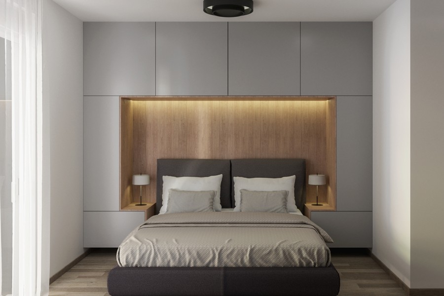 Placard encastré et habillage en bois derrière le lit