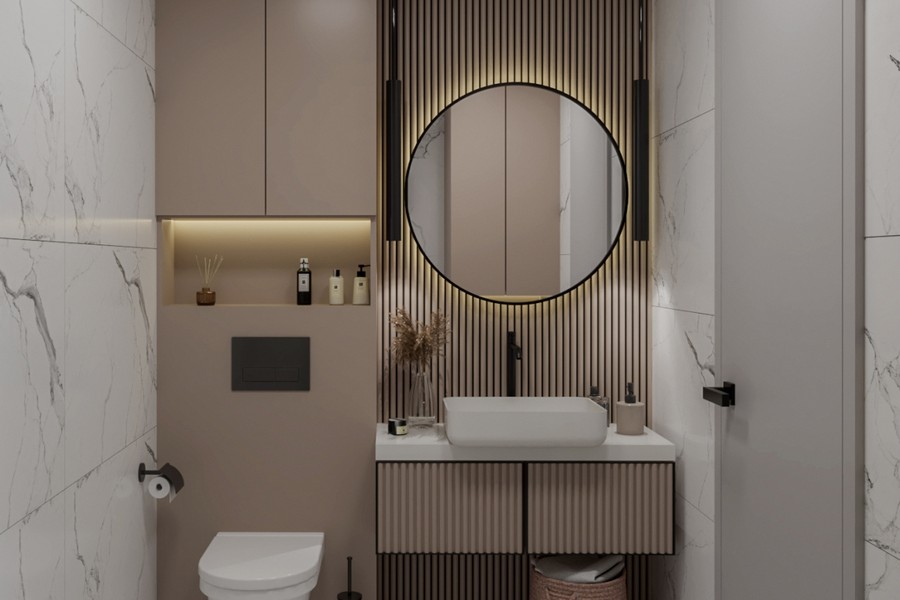Lavabo avec miroir rond dans la salle de bains