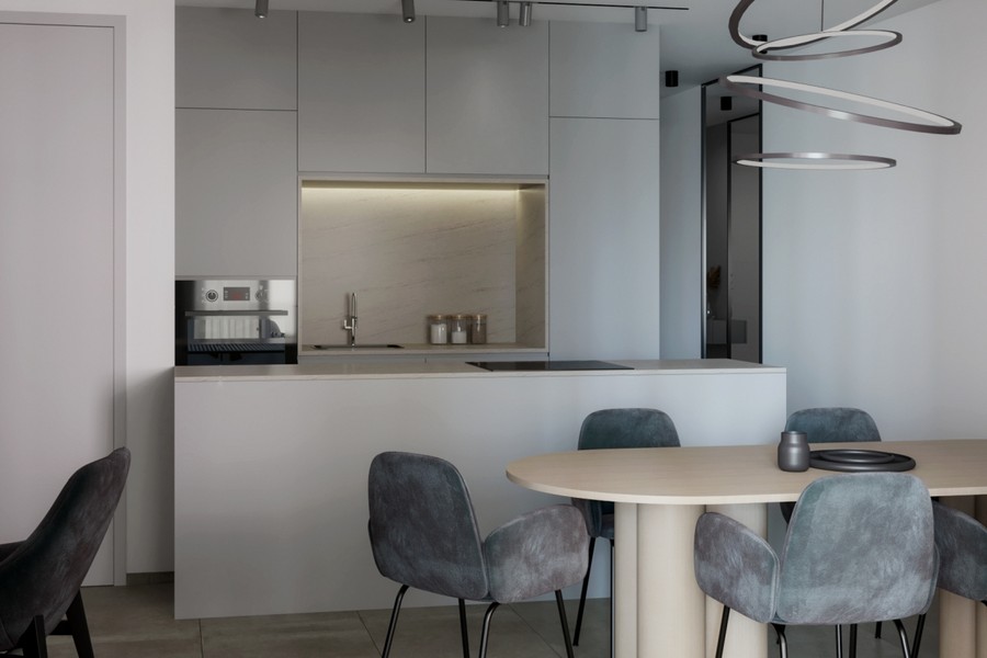 Cuisine ouverte avec îlot et chaises autour de la table à manger