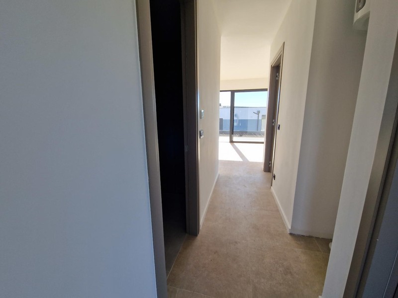 Couloir avec vue sur la loggia