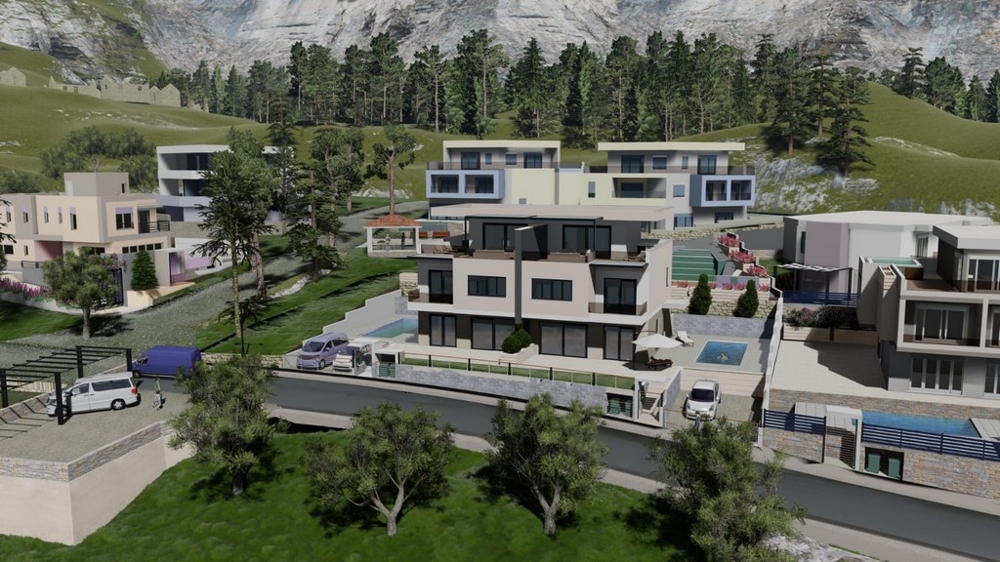 Visualisation du lotissement à flanc de colline devant la paroi rocheuse