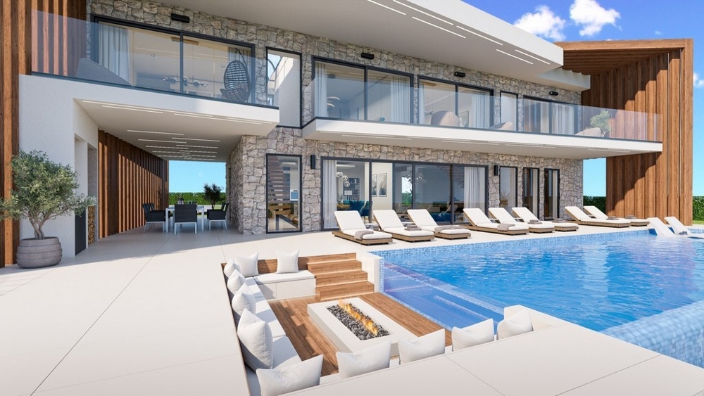 Visualisation de la terrasse de la piscine avec foyer extérieur et bains de soleil