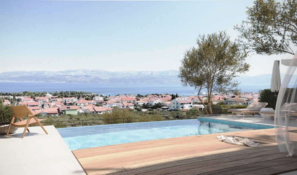 Visualisation de la piscine à débordement avec vue sur le village