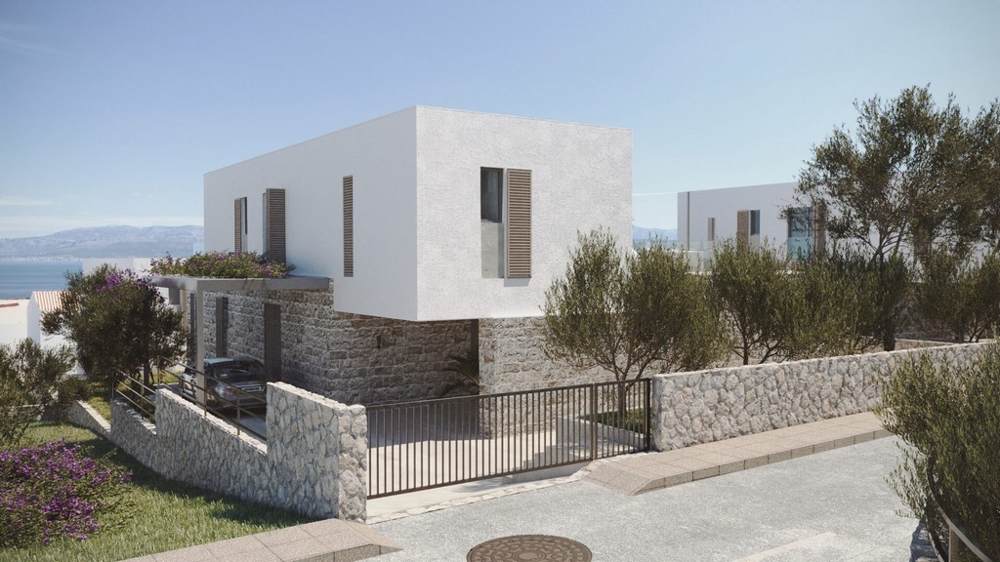 Visualisation de la maison avec soubassement en pierre naturelle derrière le portail