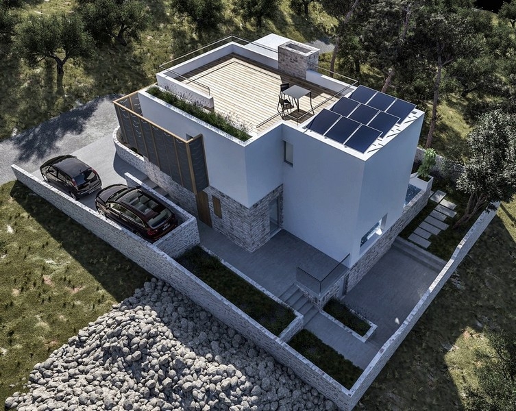 Vue par drone d'une villa neuve avec toit-terrasse et espace extérieur, à vendre sur Krk, Croatie, entourée d'oliviers
