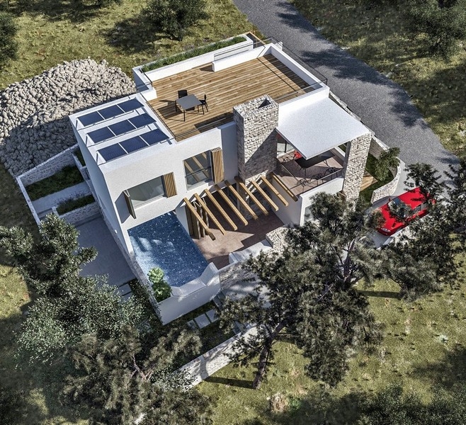 Phase de construction d'une villa en vente sur l'île croate de Krk, avec des murs en briques orange et des structures en béton
