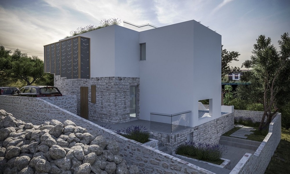 Vue aérienne d'une villa moderne à vendre sur l'île de Krk en Croatie, avec deux voitures garées et des panneaux solaires sur le toit