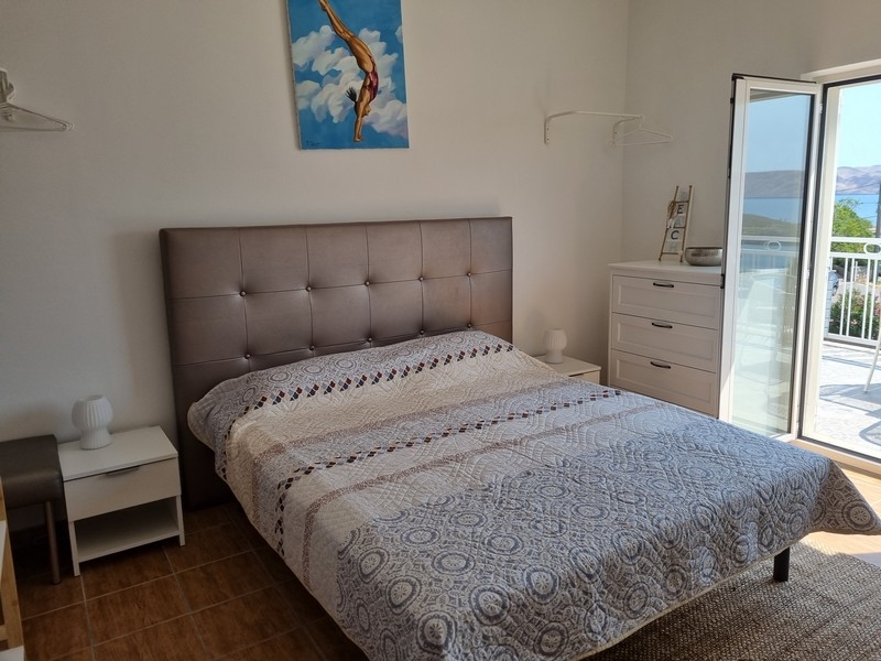 Chambre avec lit double et vue mer
