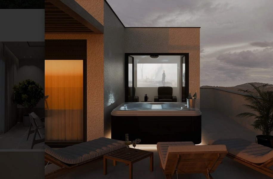 Jacuzzi sur la terrasse avec vue sur les montagnes au crépuscule