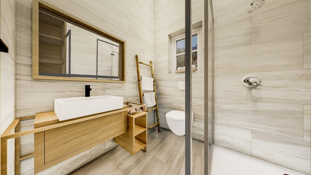 Salle de bains moderne avec meubles en bois clair, grand miroir, cabine de douche en verre et sanitaires blancs.
