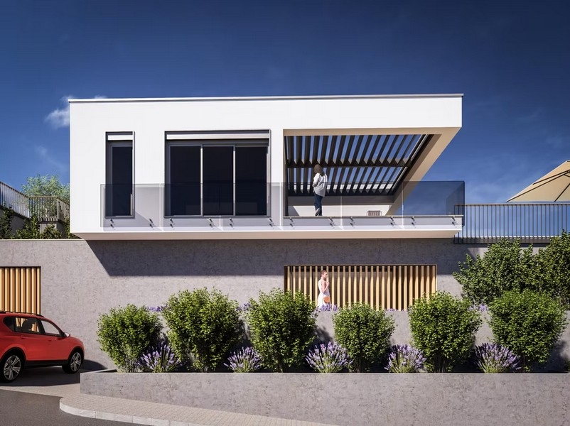 Construction neuve avec terrasse et garde-corps en verre