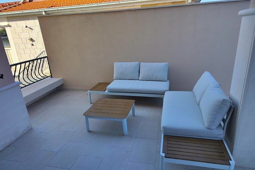 Terrasse avec mobilier lounge et coin salon