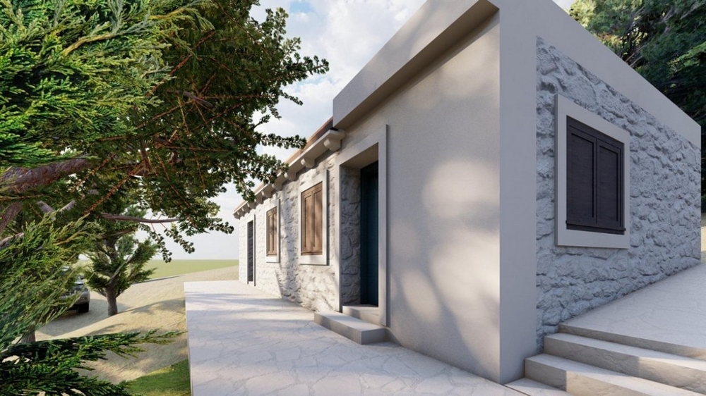 Maison à façade en pierre naturelle et vaste espace extérieur