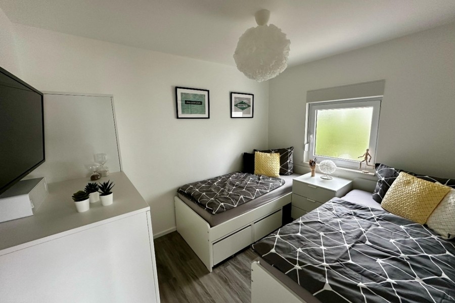 Chambre avec deux lits simples
