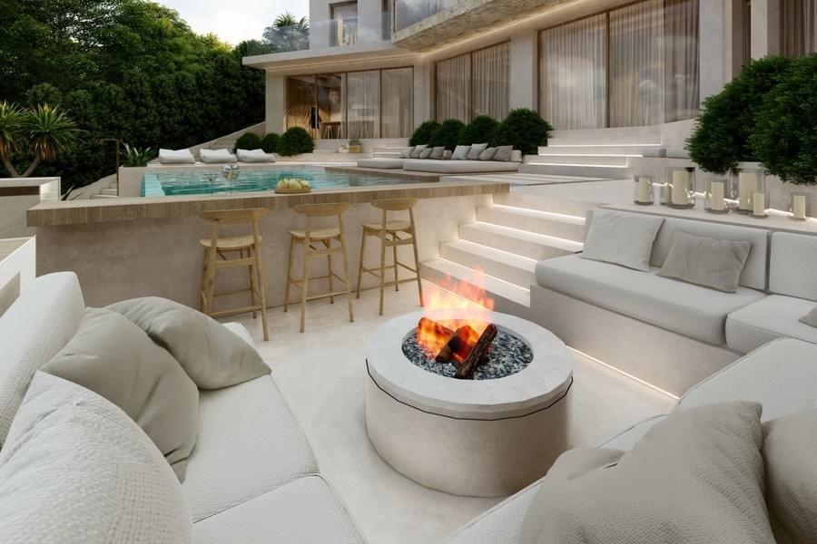 Lounge extérieur avec foyer et espace piscine d'une villa de luxe