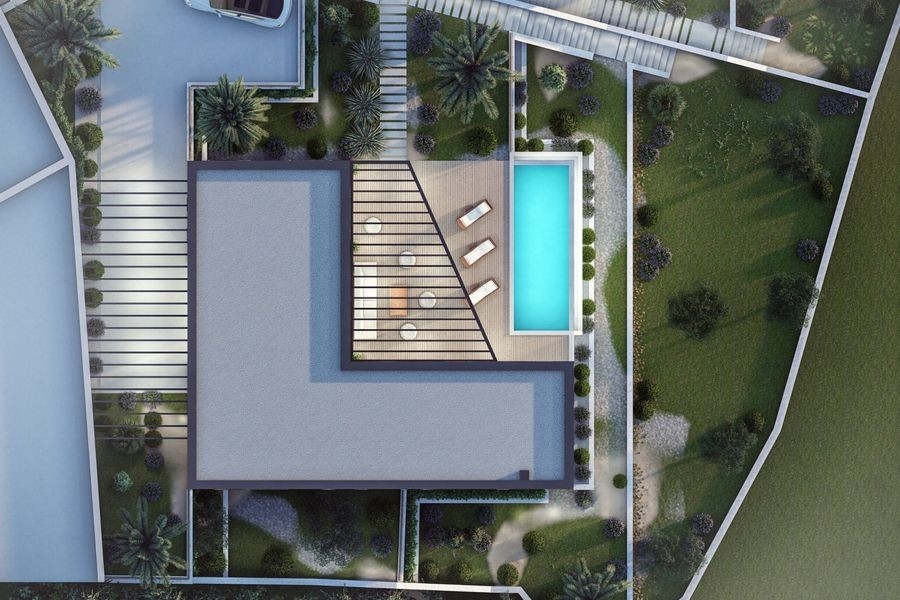 Vue extérieure de la villa avec grandes baies vitrées
