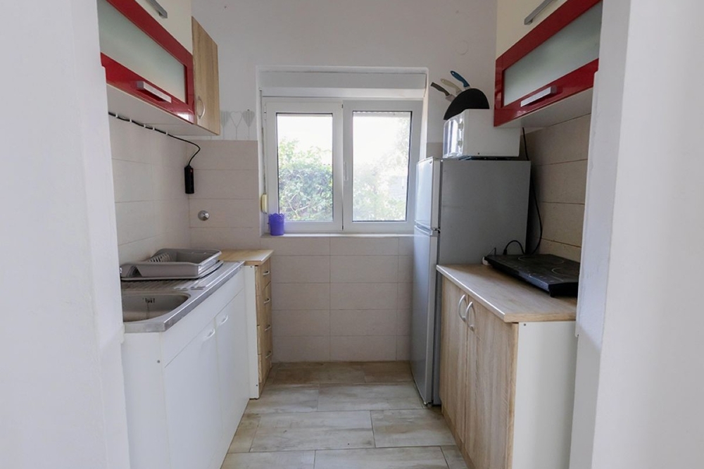 Cuisine séparée de l'appartement du rez-de-chaussée