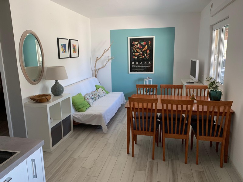 Séjour avec espace repas dans l'un des appartements, maison H4090 Povlja