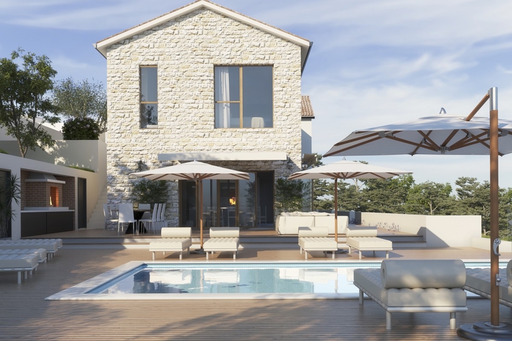 Terrasse de la piscine avec parasols et transats devant la villa