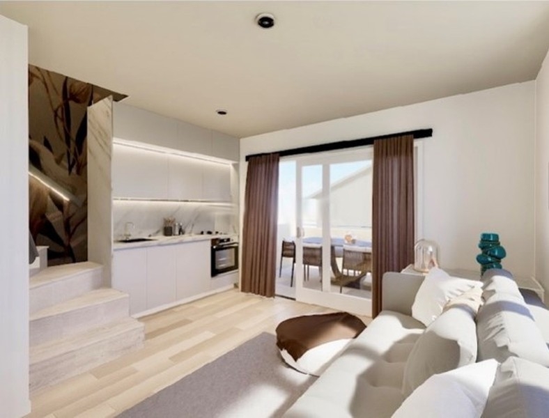 Visualisation de la cuisine et du salon avec porte donnant sur la terrasse