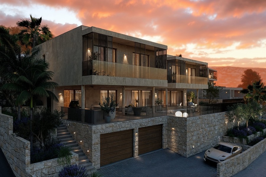 Villa avec garage et façade éclairée le soir