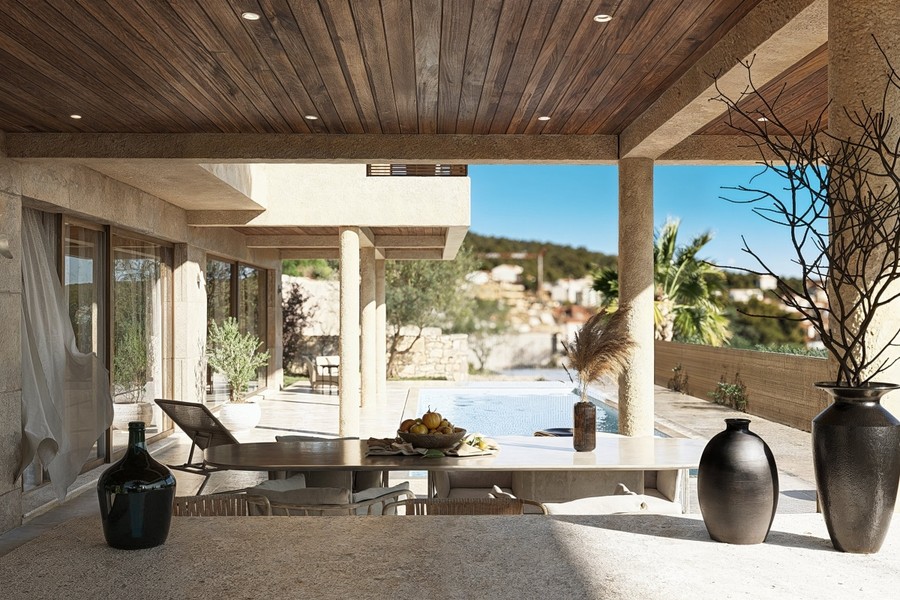 Terrasse couverte avec lounge au bord de la piscine